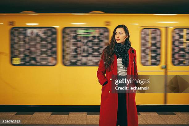 young woman in berlin subway station - street style stock pictures, royalty-free photos & images