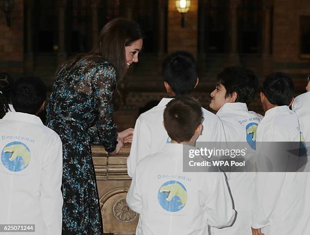 Catherine, Duchess of Cambridge attends a children's tea party with pupils from Oakington Manor Primary School in Wembley, at the Natural History...