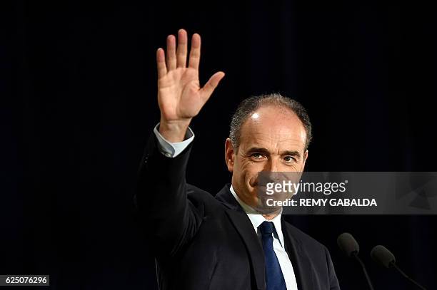 Jean-Francois Cope, former candidate for the right-wing party primaries ahead of the 2017 presidential election, waves during a public meeting for...