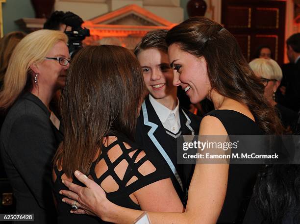 The Duchess of Cambridge comforts Ceri Knapton who joins her son Ethan Knapton from Forward Academy at the Place2Be Wellbeing in Schools Awards at...