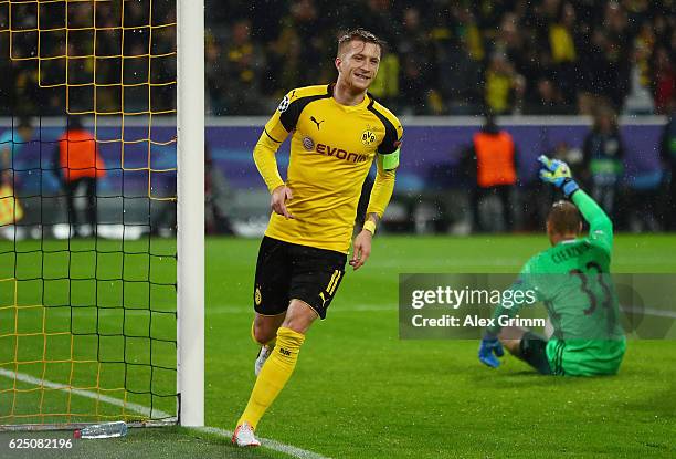 Marco Reus of Borussia Dortmund celebrates scoring his teams fifth goal with teammate Marc Bartra during the UEFA Champions League Group F match...