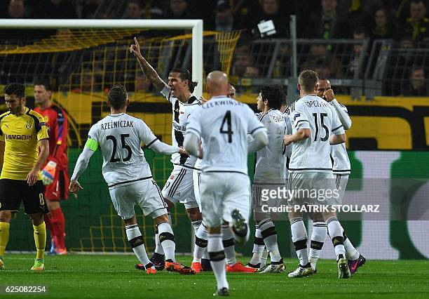 Legia´s Aleksandar Prijovic and his teammates celebrate his score during the Champions League football match between Borussia Dortmund and Legia...