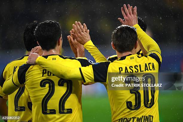 Dortmund's Japanese midfielder Shinji Kagawa and his teammates celebrate during the Champions League football match between Borussia Dortmund and...