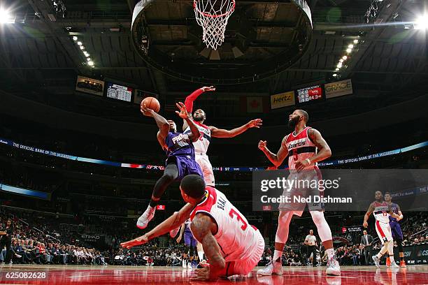 John Wall of the Washington Wizards blocks the shot of Eric Bledsoe of the Phoenix Suns on November 21, 2016 at Verizon Center in Washington, DC....