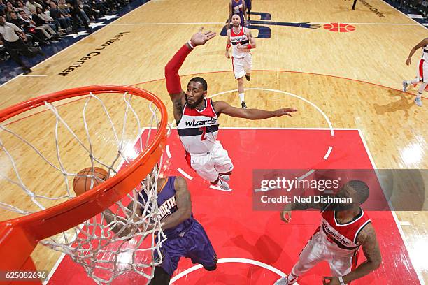 John Wall of the Washington Wizards blocks the shot of Eric Bledsoe of the Phoenix Suns on November 21, 2016 at Verizon Center in Washington, DC....