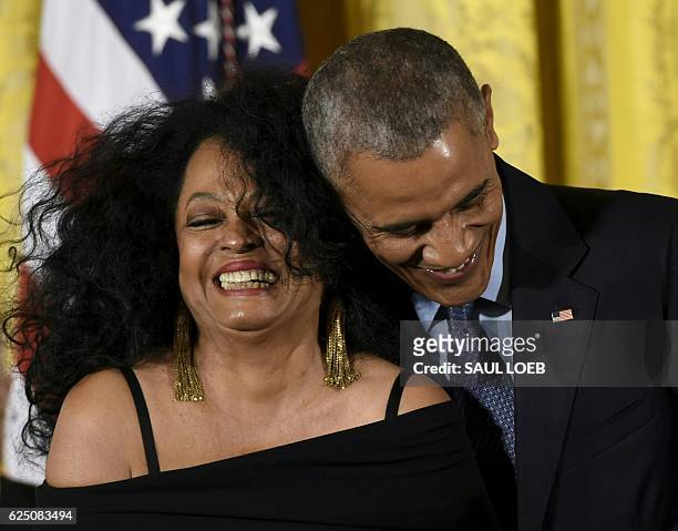 President Barack Obama hugs vocalist and musician Diana Ross during presentation of the Presidential Medal of Freedom, the nation's highest civilian...
