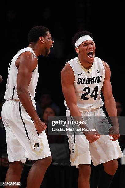 George King and Tory Miller of the Colorado Buffaloes react after a basket and a foul against the Texas Longhorns in the first half during the...