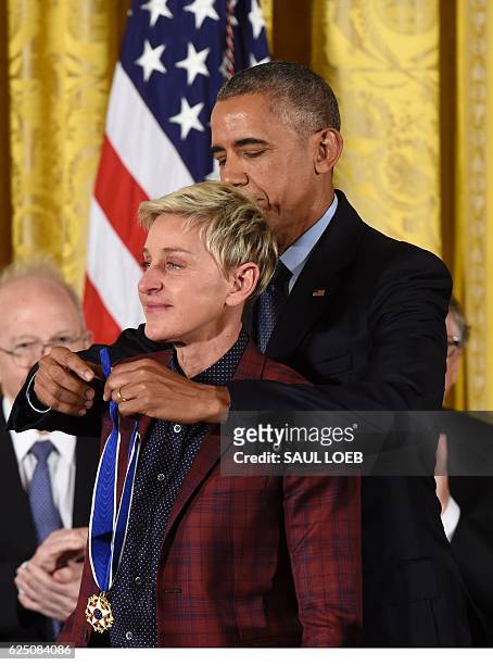 President Barack Obama presents actress and comedian Ellen DeGeneres with the Presidential Medal of Freedom, the nation's highest civilian honor,...