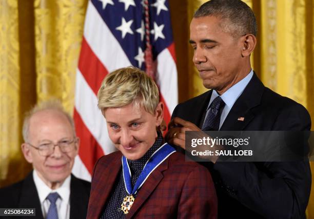 President Barack Obama presents actress and comedian Ellen DeGeneres with the Presidential Medal of Freedom, the nation's highest civilian honor,...