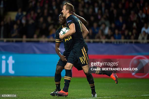 Tottenham Hotspur's English striker Harry Kane celebrates after scoring during the UEFA Champions League group E football match AS Monaco and...