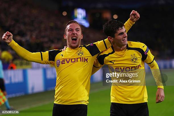 Felix Passlack of Borussia Dortmund celebrates scoring his teams seventh goal with teammate Christian Pulisic during the UEFA Champions League Group...