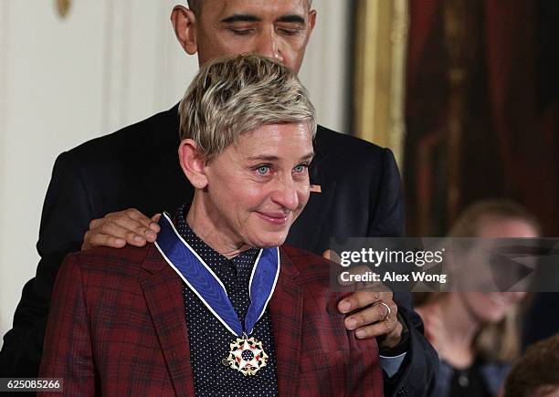 President Barack Obama presents the Presidential Medal of Freedom to comedian and talk show host Ellen DeGeneres during an East Room ceremony at the...