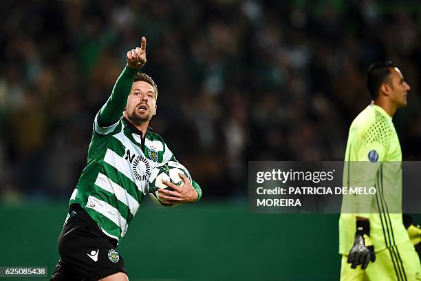 Sporting's midfielder Adrien Silva celebrates after scoring a penalty goal during the UEFA Champions League football match Sporting CP vs Real Madrid...