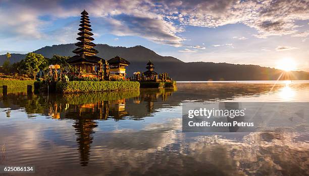 panorama of sunrise at pura ulun danu bratan, bali, indonesia - bali temple stock pictures, royalty-free photos & images