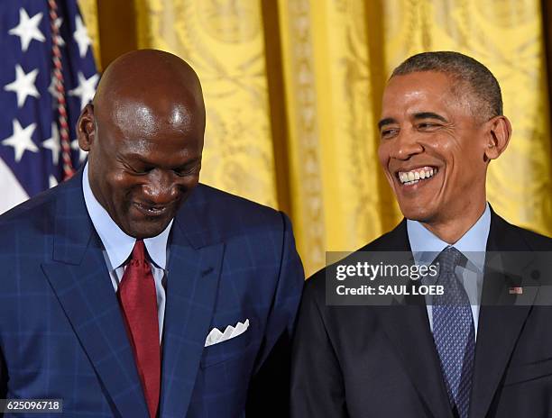 President Barack Obama and NBA athlete Michael Jordan share a smile during the presentation of the Presidential Medal of Freedom, the nation's...