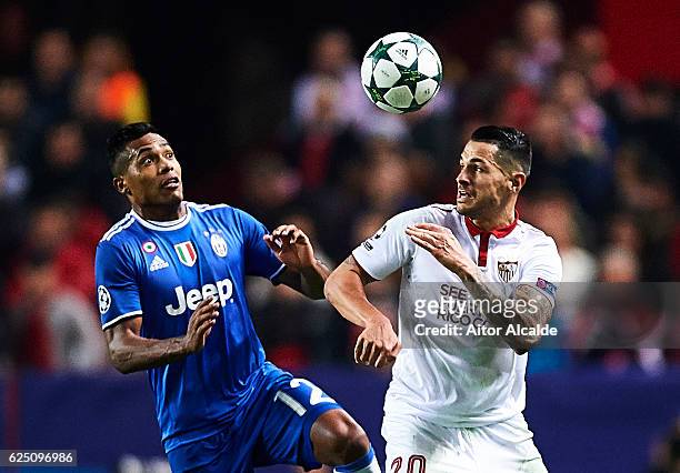 Alex Sandro of Juventus competes for the ball with Victor Machin Perez "Vitolo" of Sevilla FC during the UEFA Champions League match between Sevilla...
