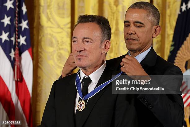 President Barack Obama awards the Presidential Medal of Freedom to popular music singer, songwriter and rock and roll legend Bruce Springsteen during...