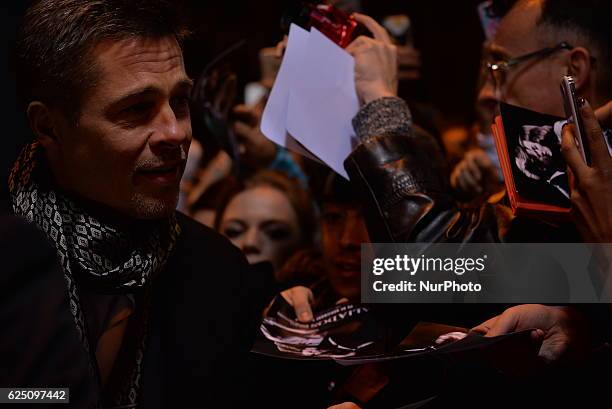 Actor Brad Pitt takes selfie to his fans as they arrive to attend the Spain premiere of the film 'Allied' in Callao City Lights, central Madrid on...