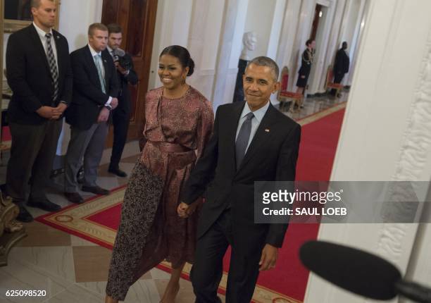 President Barack Obama and First Lady Michelle Obama arrive to present the Presidential Medal of Freedom, the nation's highest civilian honor, during...