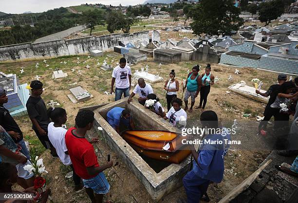 The casket of Leonardo Martins da Silva Junior who was killed during a weekend police operation in the Cidade de Deus 'City of God' favela community,...