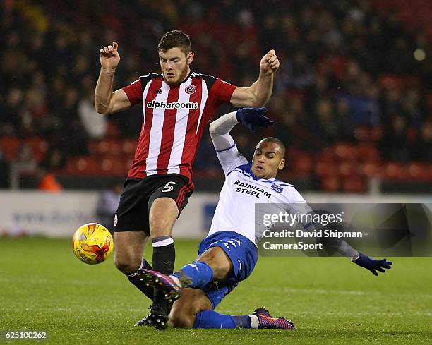 Sheffield United's Jack O'Connell is tackled by Bury's James Vaughan during the Sky Bet League One match between Sheffield United and Bury at Bramall...