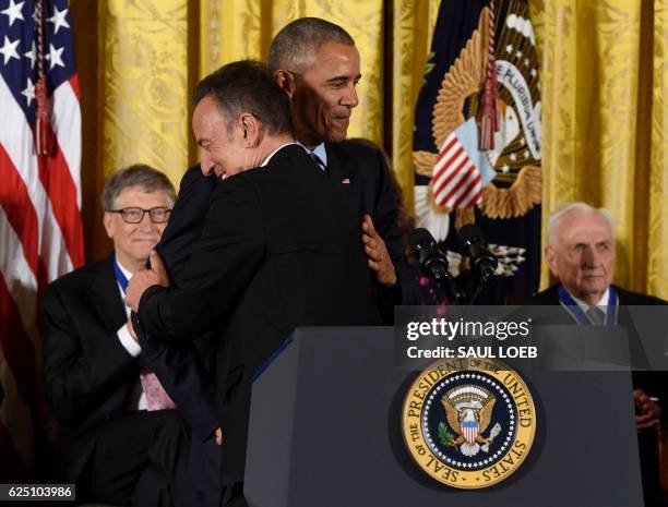 President Barack Obama hugs musician Bruce Springsteen after presenting him with the Presidential Medal of Freedom, the nation's highest civilian...