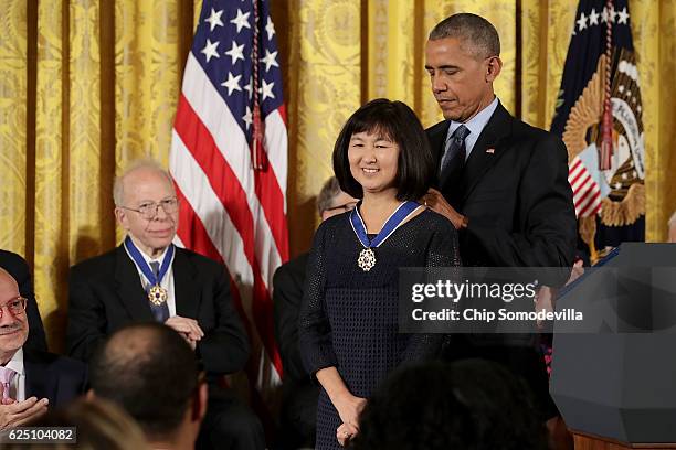 President Barack Obama awards the Presidential Medal of Freedom to Artist and architect Maya Lin during a ceremony in the East Room of the White...