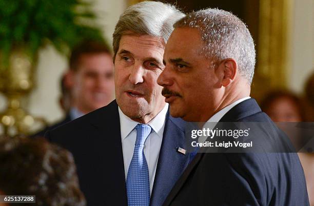 Secretary of State John Kerry speaks with Eric Holder during the 2016 Presidential Medal Of Freedom ceremony at the White House on November 22, 2016...