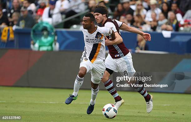 Dillon Powers of Colorado Rapids holds Ashley Cole of Los Angeles Galaxy during leg one of the Audi 2016 MLS Cup Playoff Western Conference Semfinal...