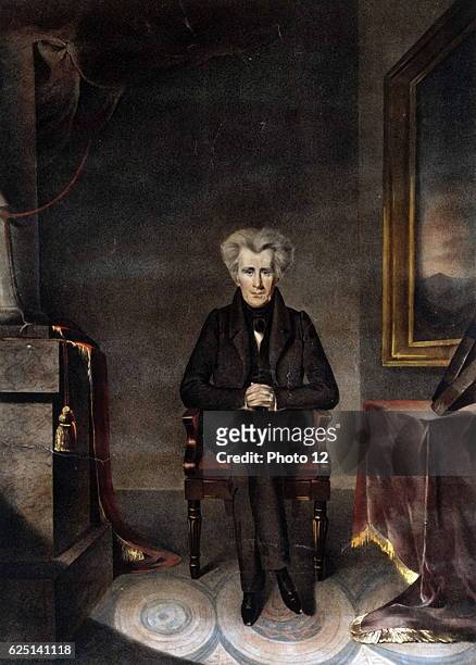 Andrew Jackson, American soldier and Seventh President of the United States 1829-1837. Lithograph of Jackson seated beside a table.