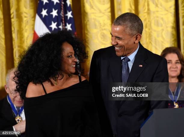 President Barack Obama presents vocalist and musician Diana Ross with the Presidential Medal of Freedom, the nation's highest civilian honor, during...