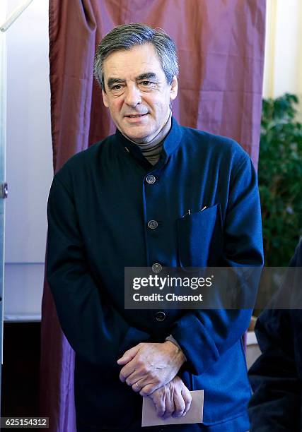 Former French Prime Minister and presidential candidate hopeful Francois Fillon votes during the first round of voting in the Republican Party's...