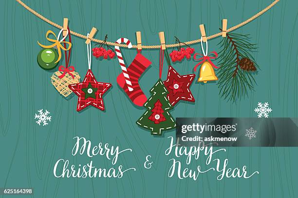 christmas handmade decorations on a wooden surface - sock vector stock illustrations