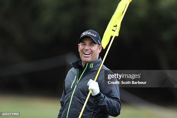 Former cricketer Shane Warne looks on as he plays with Graeme McDowell of Northern Ireland on Pro-Am Day ahead of the World Cup of Golf at Kingston...