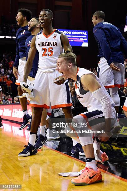 Kyle Guy and Mamadi Diakite of the Virginia Cavaliers celebrate after a basket in the second half during a game against the Grambling State Tigers at...