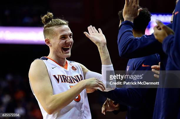 Kyle Guy of the Virginia Cavaliers celebrates with his teammates in the second half during a game against the Grambling State Tigers at John Paul...