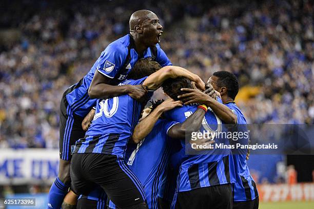 Matteo Mancosu of the Montreal Impact celebrates his goal with teammates in the first half during leg one of the MLS Eastern Conference finals...
