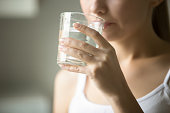 Female drinking from a glass of water