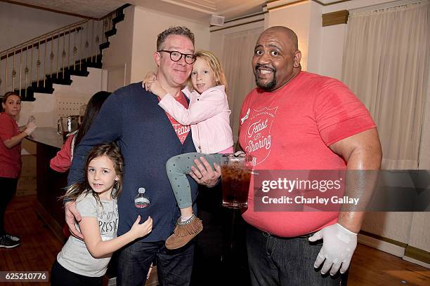 Actors Chris Tallman of The Thundermans and Bubba Ganter from Game Shakers attend the 'Salvation Army's Feast of Sharing Holiday Dinner' presented by...