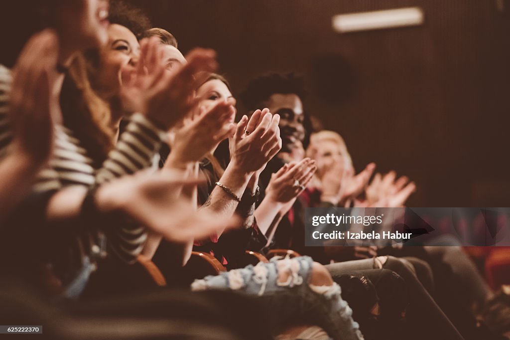 Audience applauding in the theater