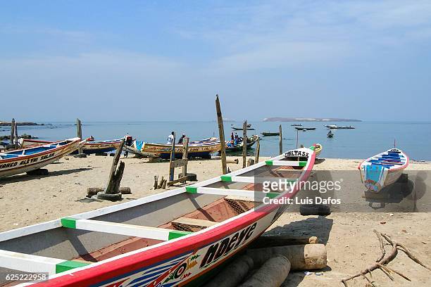 fishing boats at n'gor beach - dakar stock pictures, royalty-free photos & images