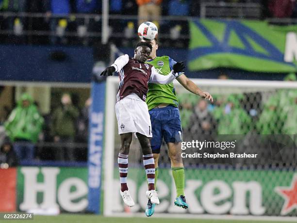 Dominique Badji, left, of the Colorado Rapids and Chad Marshall of the Seattle Sounders goes up for a header during the second half of a match in the...