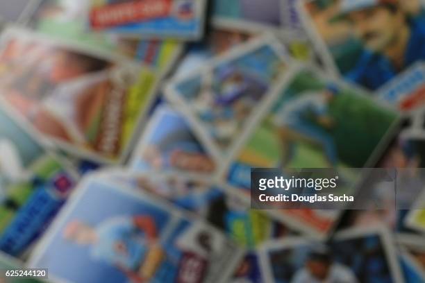 blurry image of collectors baseball trading cards - baseball card collection stockfoto's en -beelden