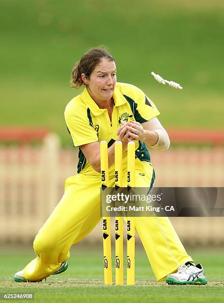 Rene Farrell of Australia attempts to run out Mignon du Preez of South Africa during the women's One Day International match between the Australian...
