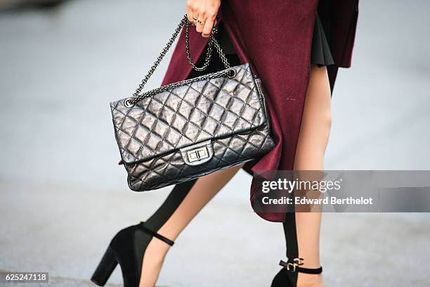 May Berthelot , is wearing New Look babies shoes, a Topshop skirt, New Look purple burgundy coat, a Chanel 2.55 black bag, Chanel bicolor tights with...