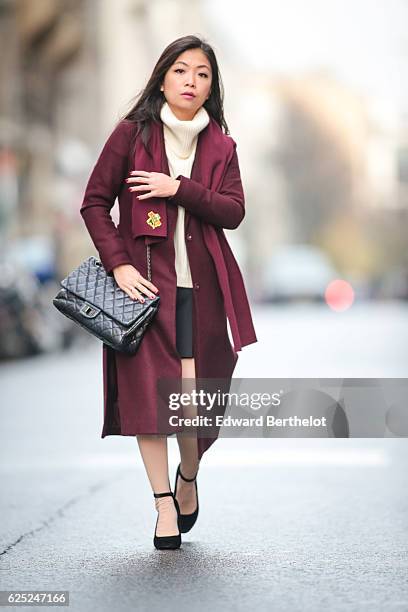 May Berthelot , is wearing New Look babies shoes, a Topshop skirt, New Look purple burgundy coat, a Chanel 2.55 black bag, Chanel bicolor tights with...