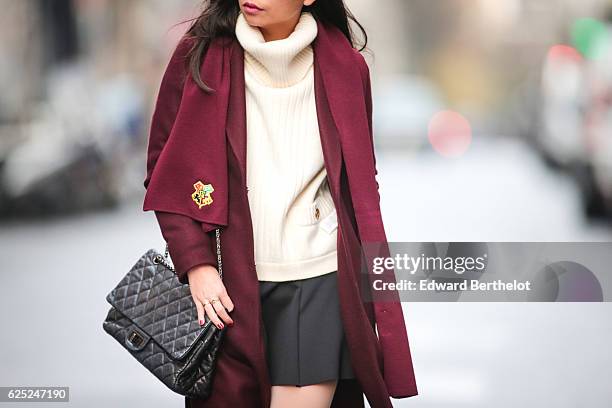 May Berthelot , is wearing New Look babies shoes, a Topshop skirt, New Look purple burgundy coat, a Chanel 2.55 black bag, Chanel bicolor tights with...