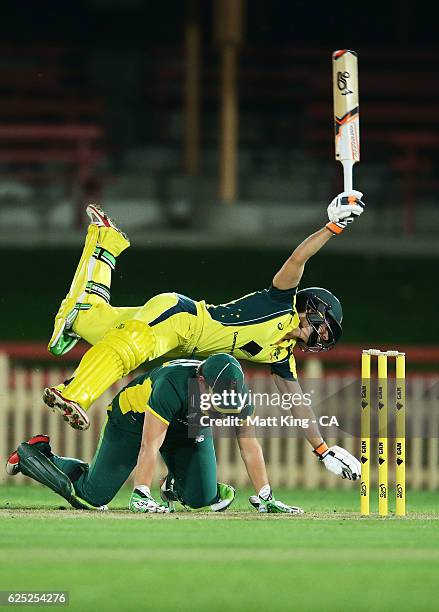 Nicole Bolton of Australia collides with South African wicketkeeper Lizelle Lee during the women's One Day International match between the Australian...