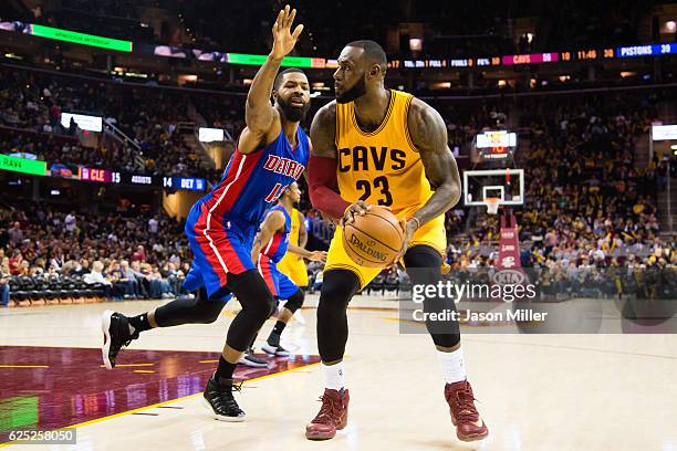 Marcus Morris of the Detroit Pistons guards LeBron James of the Cleveland Cavaliers during the second half at Quicken Loans Arena on November 18,...