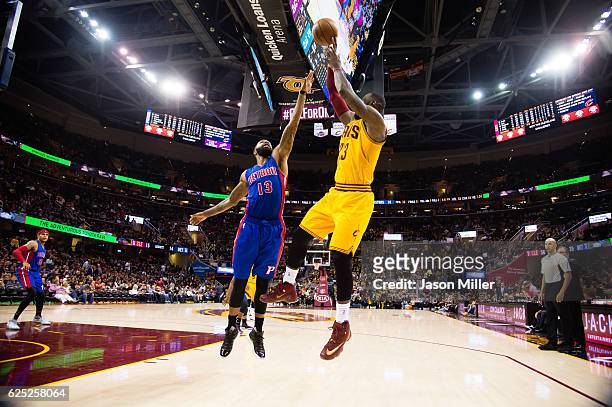 Marcus Morris of the Detroit Pistons guards LeBron James of the Cleveland Cavaliers during the second half at Quicken Loans Arena on November 18,...